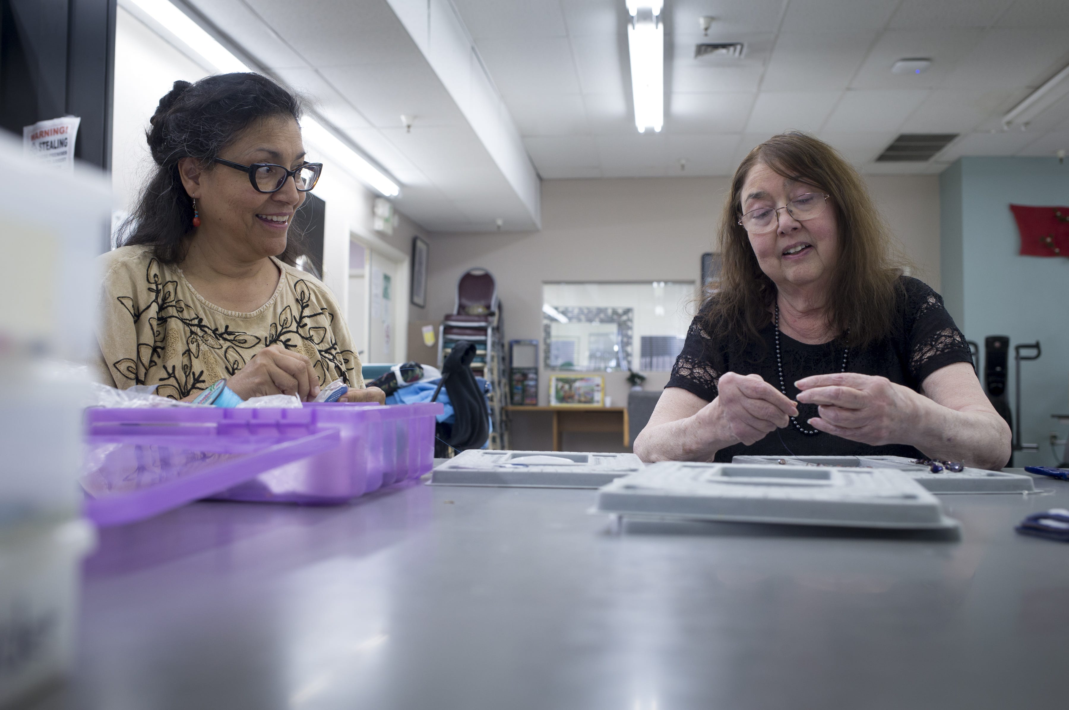 Barbara Cory (right) and Cynthia Fodness make jewelry, Dec. 12, 2018 at Phoenix Senior Opportunities, 1220 S. Seventh Ave. in Phoenix. Cory copes with asthma that can flare up when smog worsens in Phoenix’s winter months.